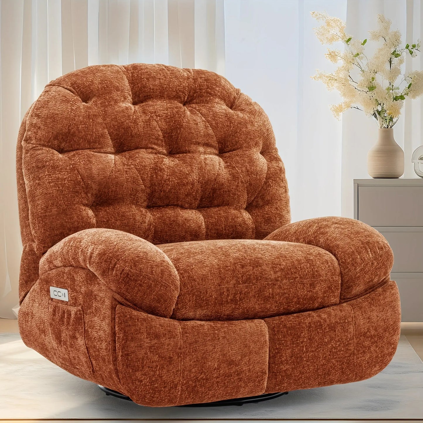 Brown textured armchair in a room with light-colored walls and a small table with flowers.