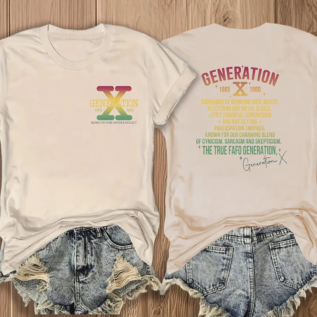 Beige t-shirt with 'Generation X' design and denim shorts on a wooden surface