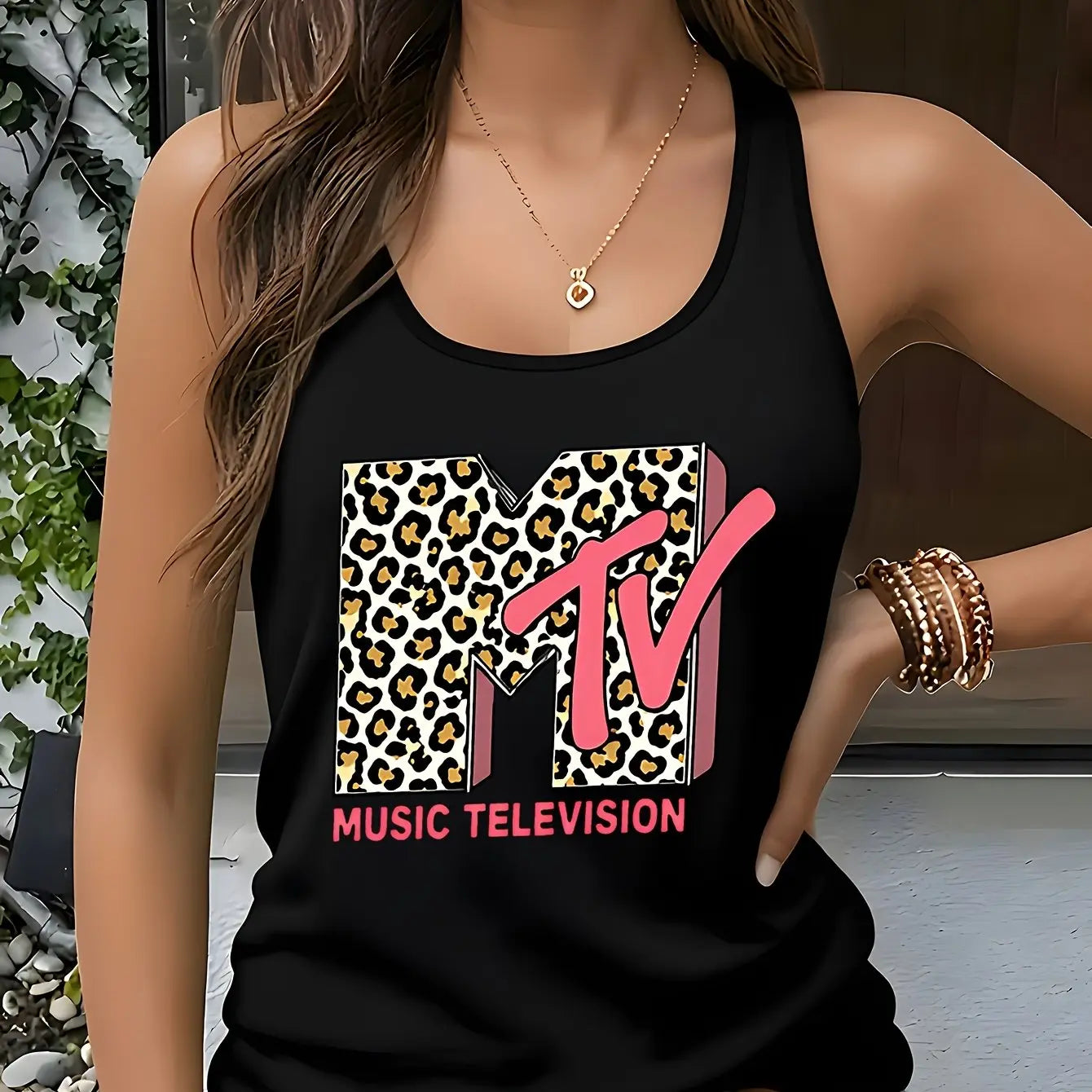 Model showcasing the Fantascticz 80s style racerback tank top in classic black, making the iconic leopard print MTV Music Television logo stand out with vibrant retro style.