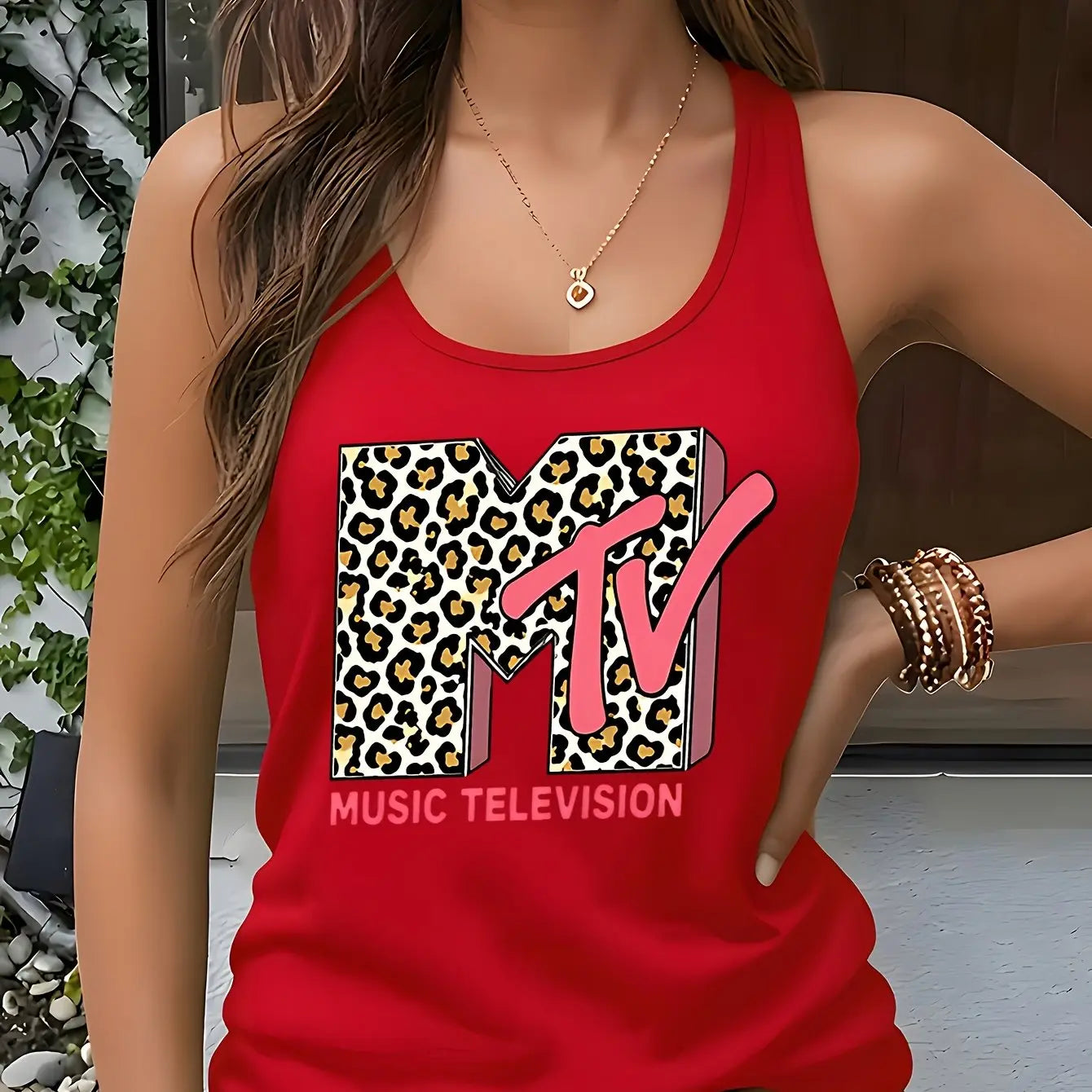 Model wearing the Fantascticz 80s style racerback tank top in vibrant red, featuring the iconic MTV Music Television logo with a bold leopard print fill.