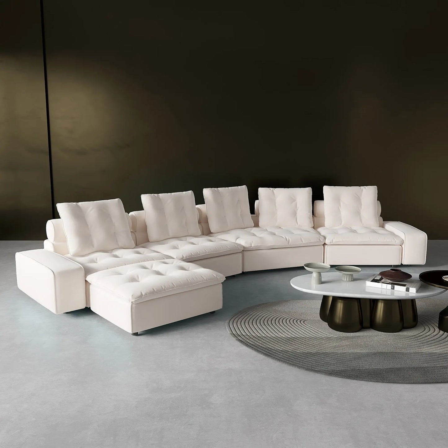 Modern white sectional sofa in a minimalistic living room setting with a dark wall.