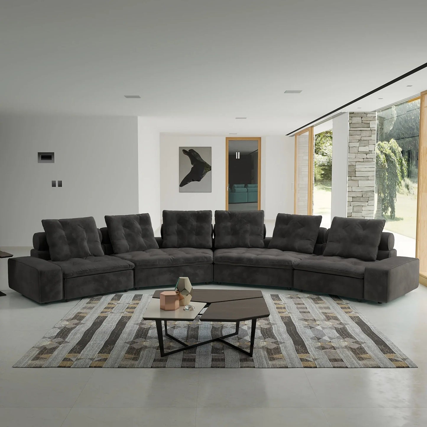 Gray sectional sofa in a modern living room with a coffee table and rug.
