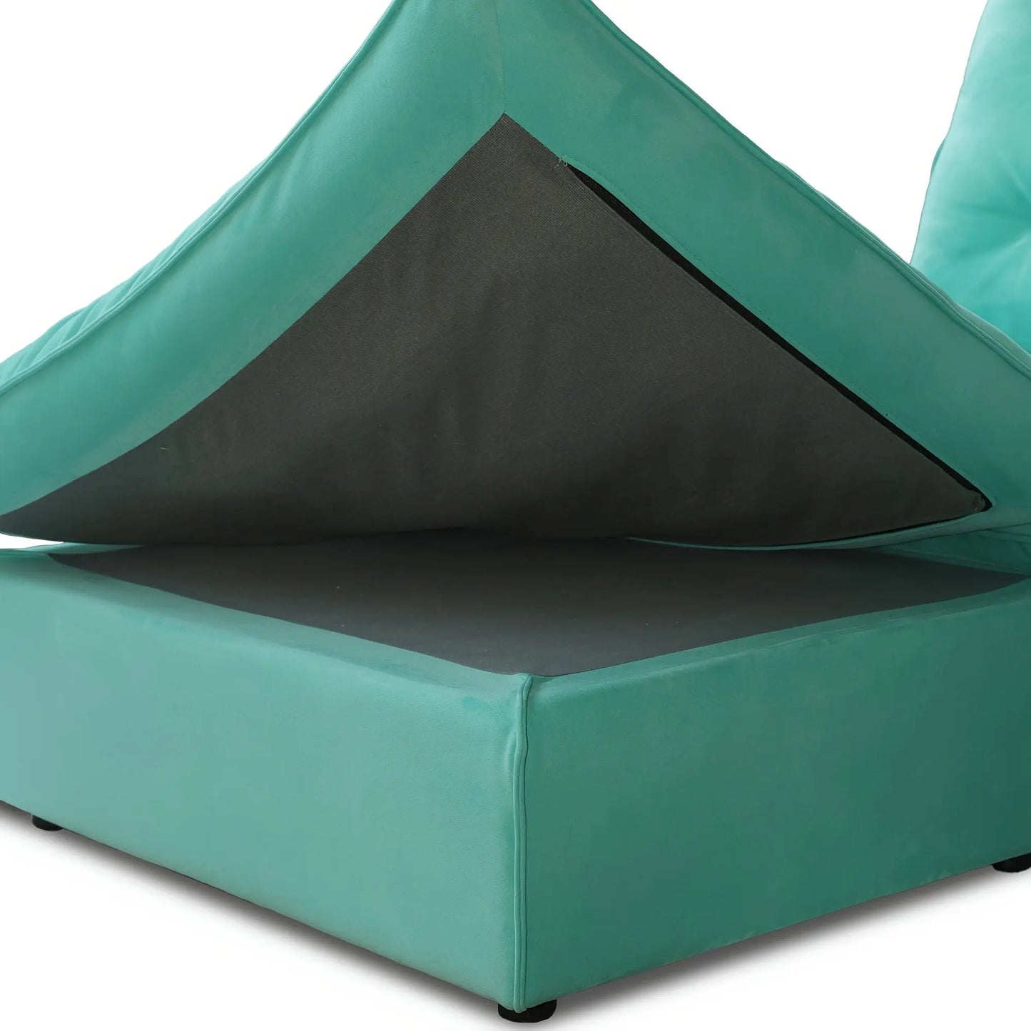 Teal cushion with a black interior on a white background