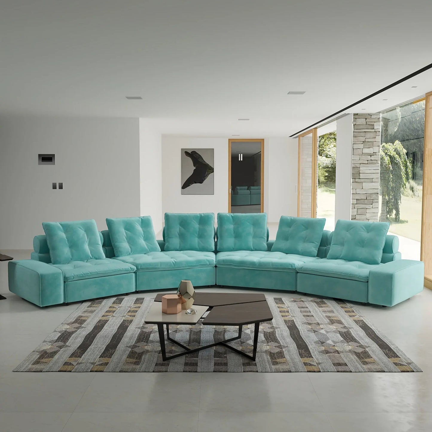 Turquoise sectional sofa in a modern living room with a coffee table and decorative items.