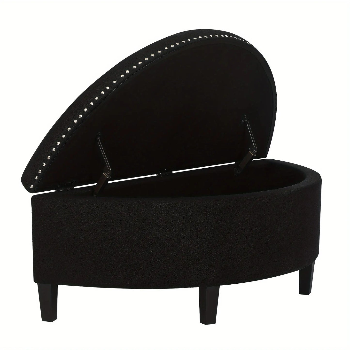 The Rhythm Storage Ottoman by Fantascticz in a timeless black fabric, shown with its lid propped open by a safety hinge to reveal the generous, lined storage space inside. The elegant silver nailhead trim provides a striking contrast.