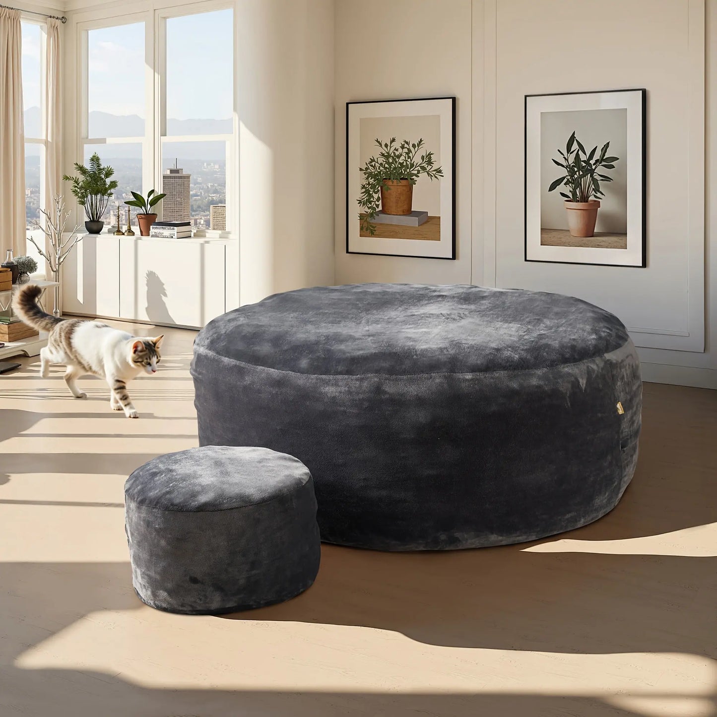 A lifestyle image of The Sanctuary Lounger and ottoman set by Fantascticz, featured in a chic charcoal gray fabric. The set provides a touch of sophisticated comfort, perfectly complementing the bright, airy, and modern apartment setting.