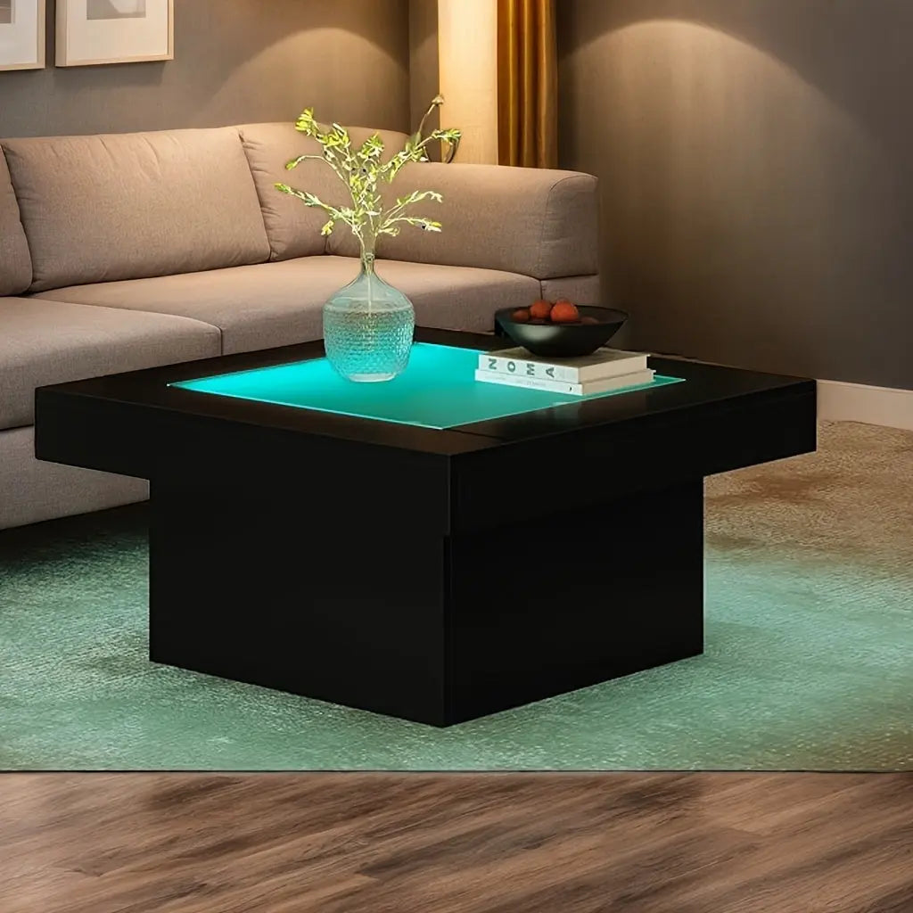 Modern living room with a black coffee table, gray sofa, and decorative items.