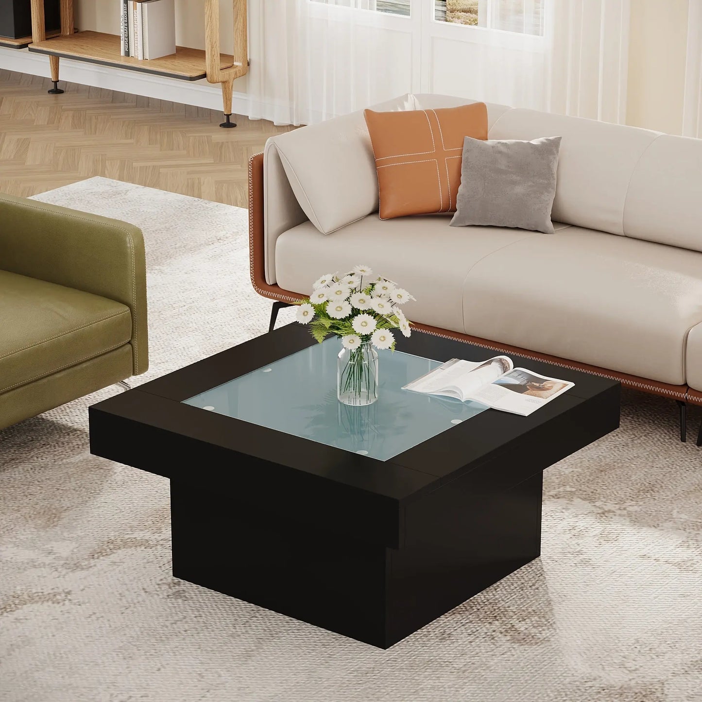 Modern living room with a black coffee table, sofa, and decorative items.