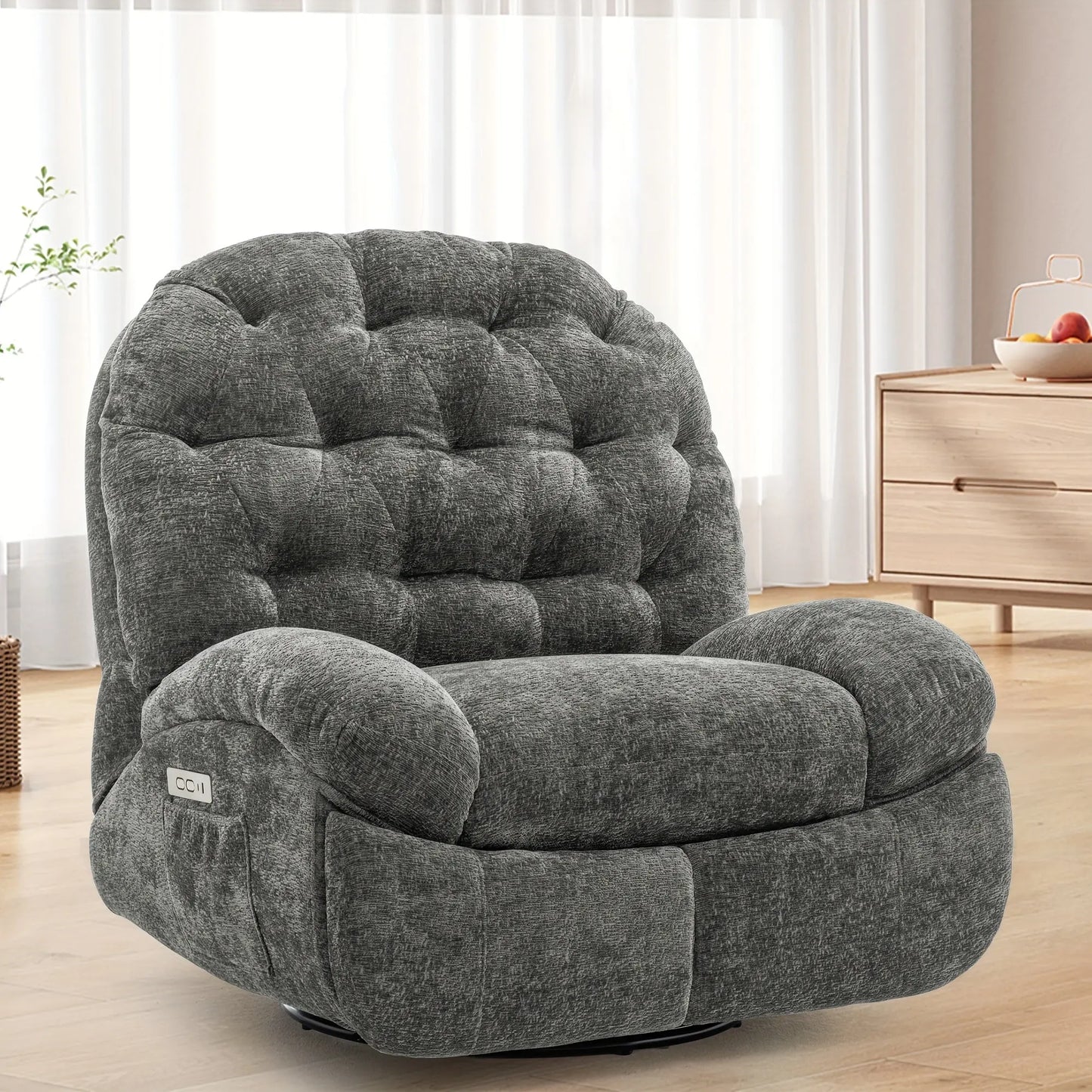 Gray recliner chair in a room with light-colored curtains and wooden furniture.