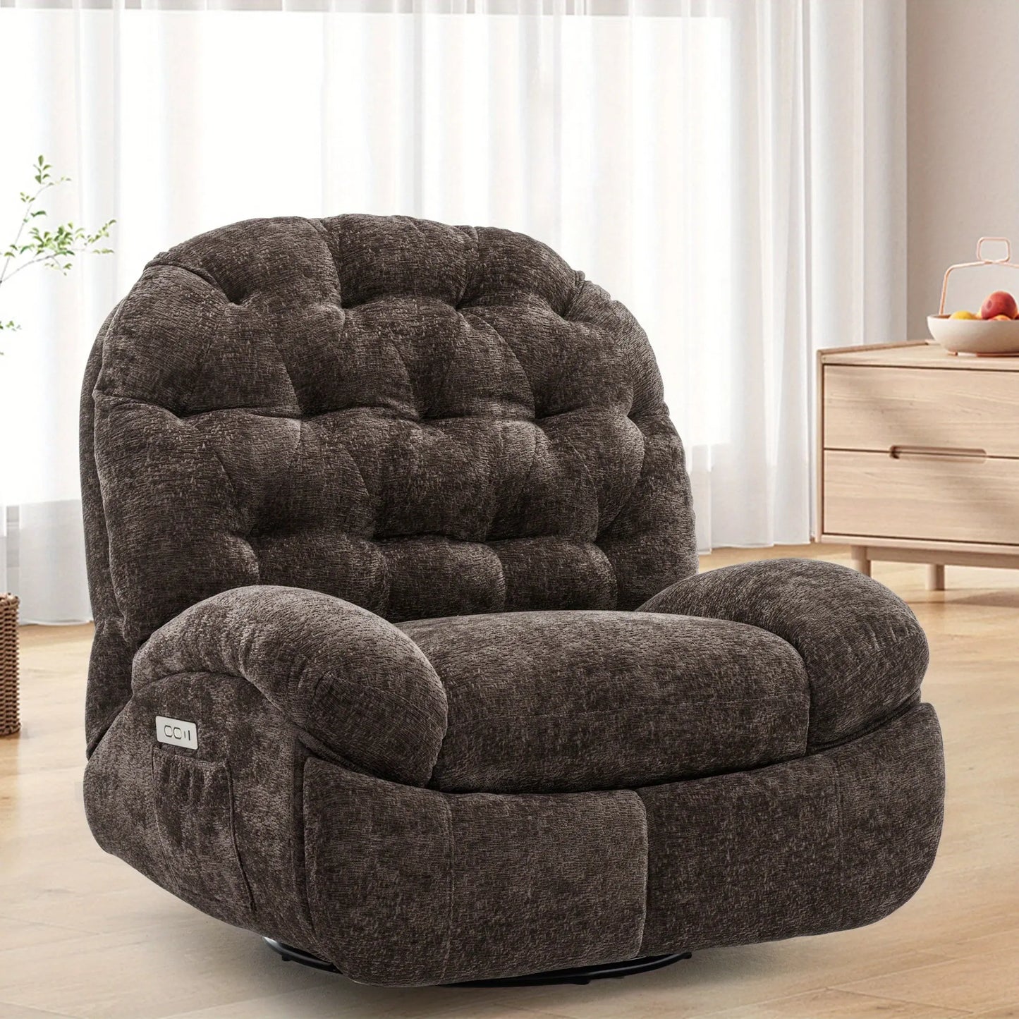 Brown plush armchair in a room with light-colored curtains and wooden furniture.