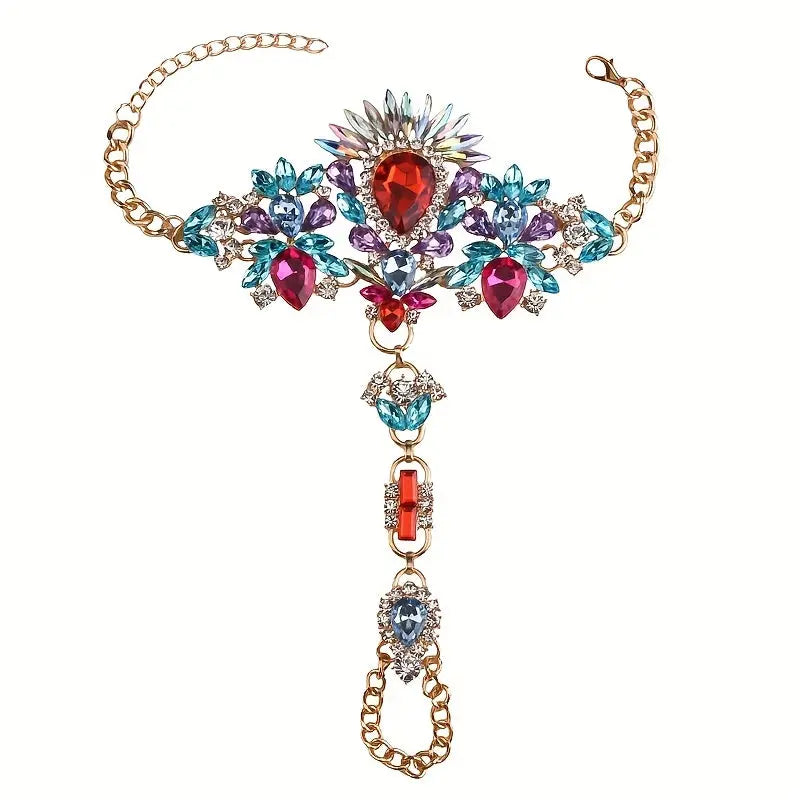 Product shot of The Empress barefoot sandals in multicolor, featuring a vibrant mix of red, blue, and fuchsia crystals set in a gold-tone frame on a white background.