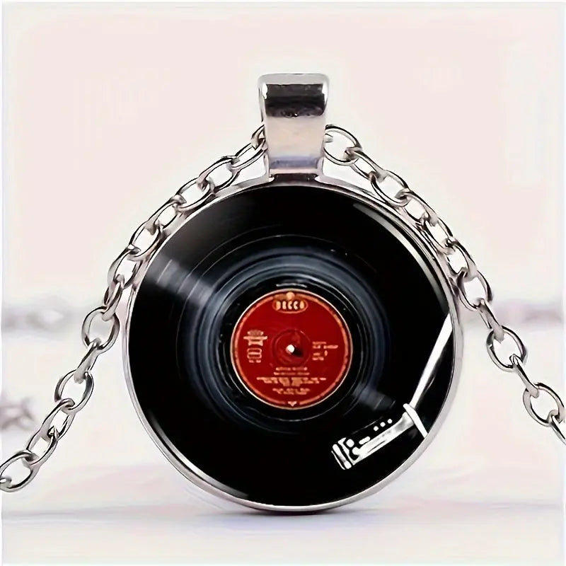 Necklace with a vinyl record pendant on a light pink background