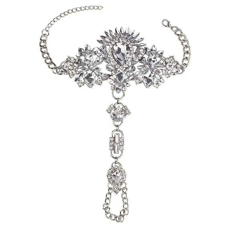 Product shot of The Solaris barefoot sandals in brilliant silver, featuring a sunburst ankle cuff with clear diamond-like crystals on a white background.