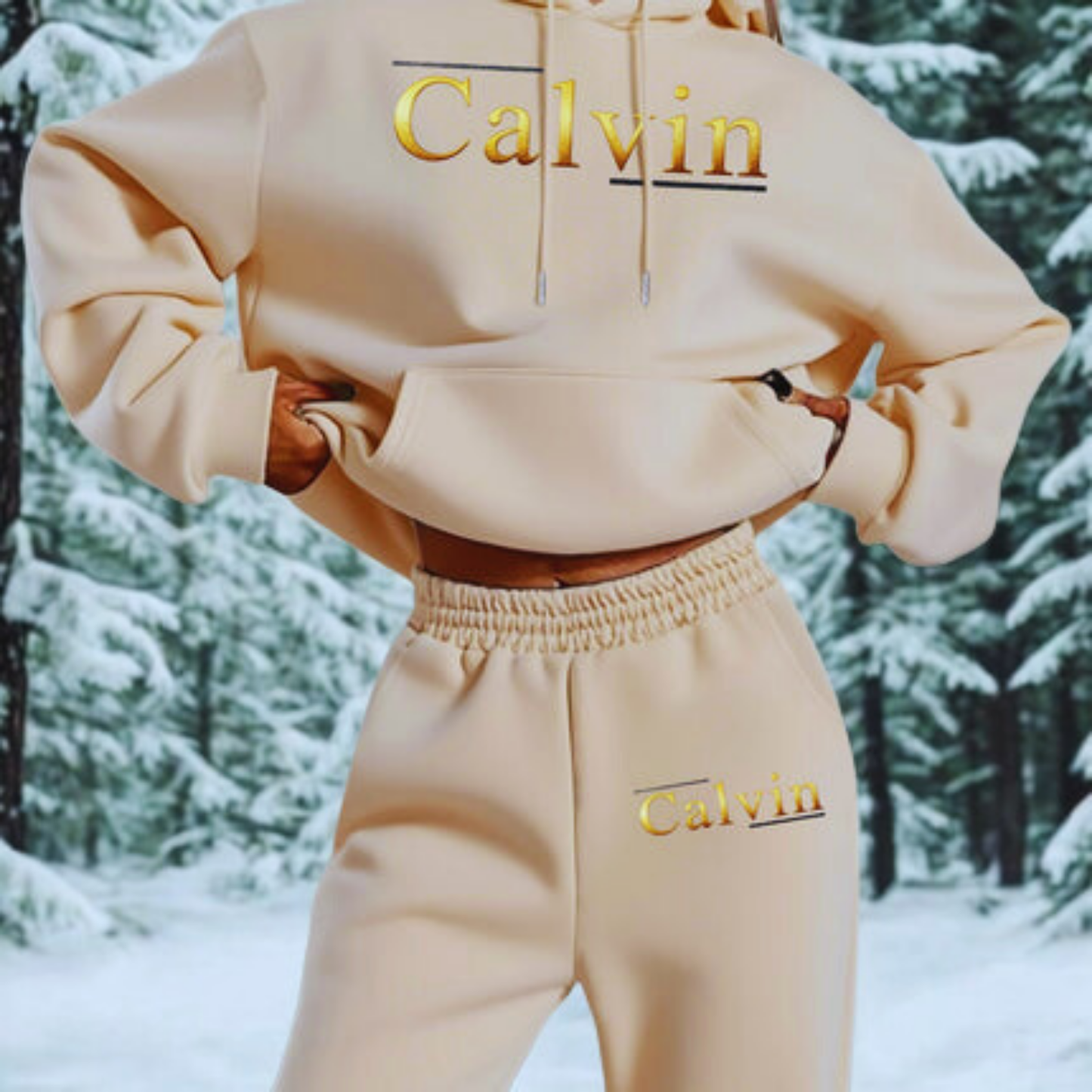 Person wearing a beige 'Calvin' hoodie and pants in a snowy forest setting