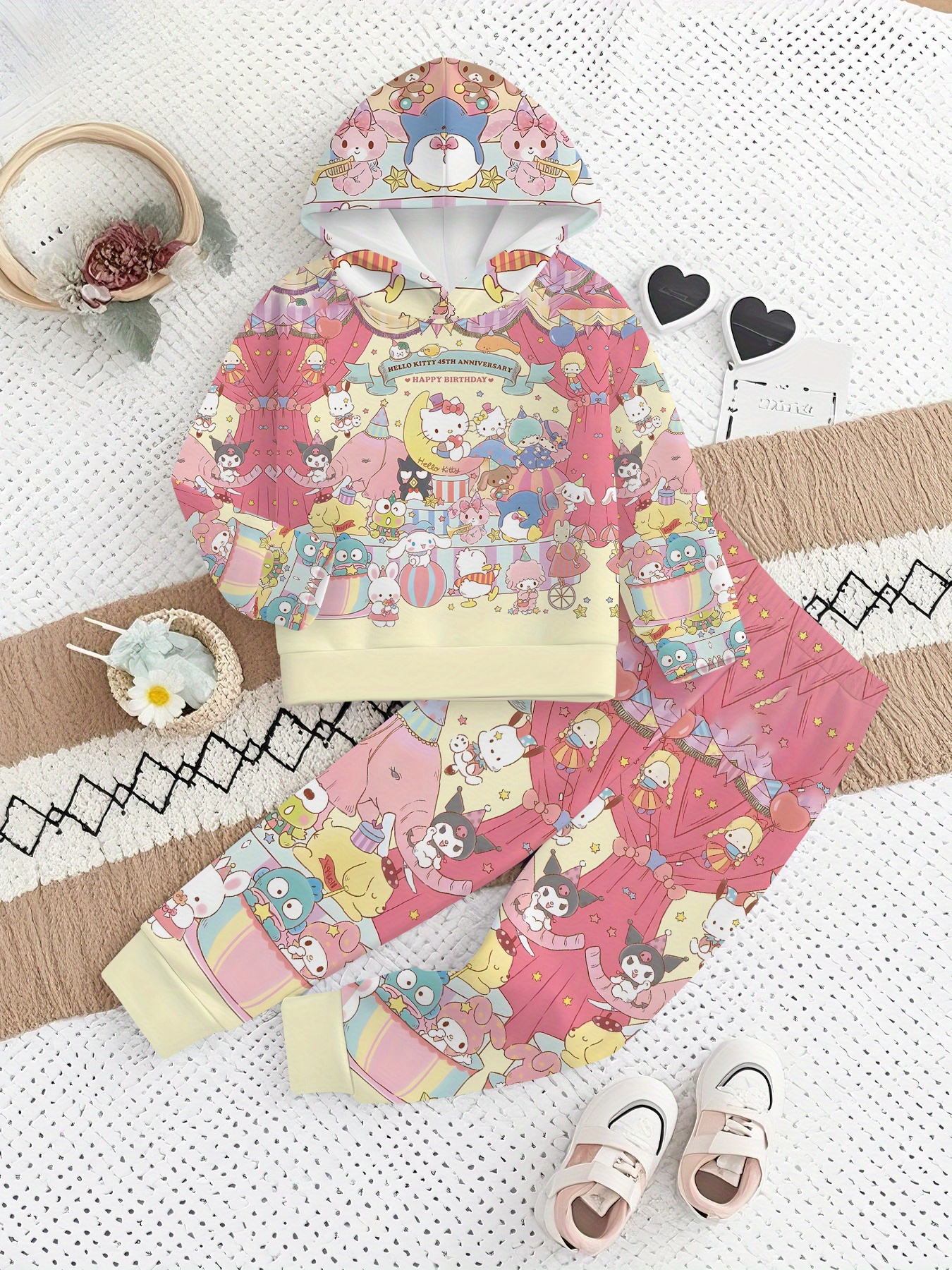 Children's outfit with a colorful pattern on a textured surface
