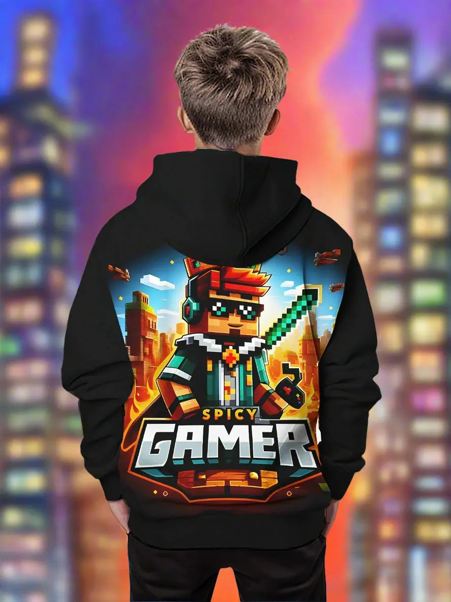 Person wearing a black hoodie with a colorful 'Spicy Gamer' design on the back, standing in a room with a plant and sports equipment.