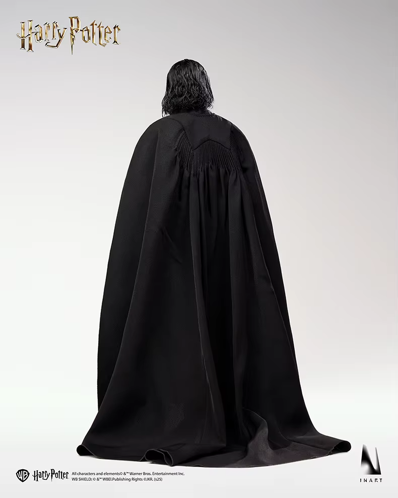 Person wearing a black cloak with 'Harry Potter' branding on a white background