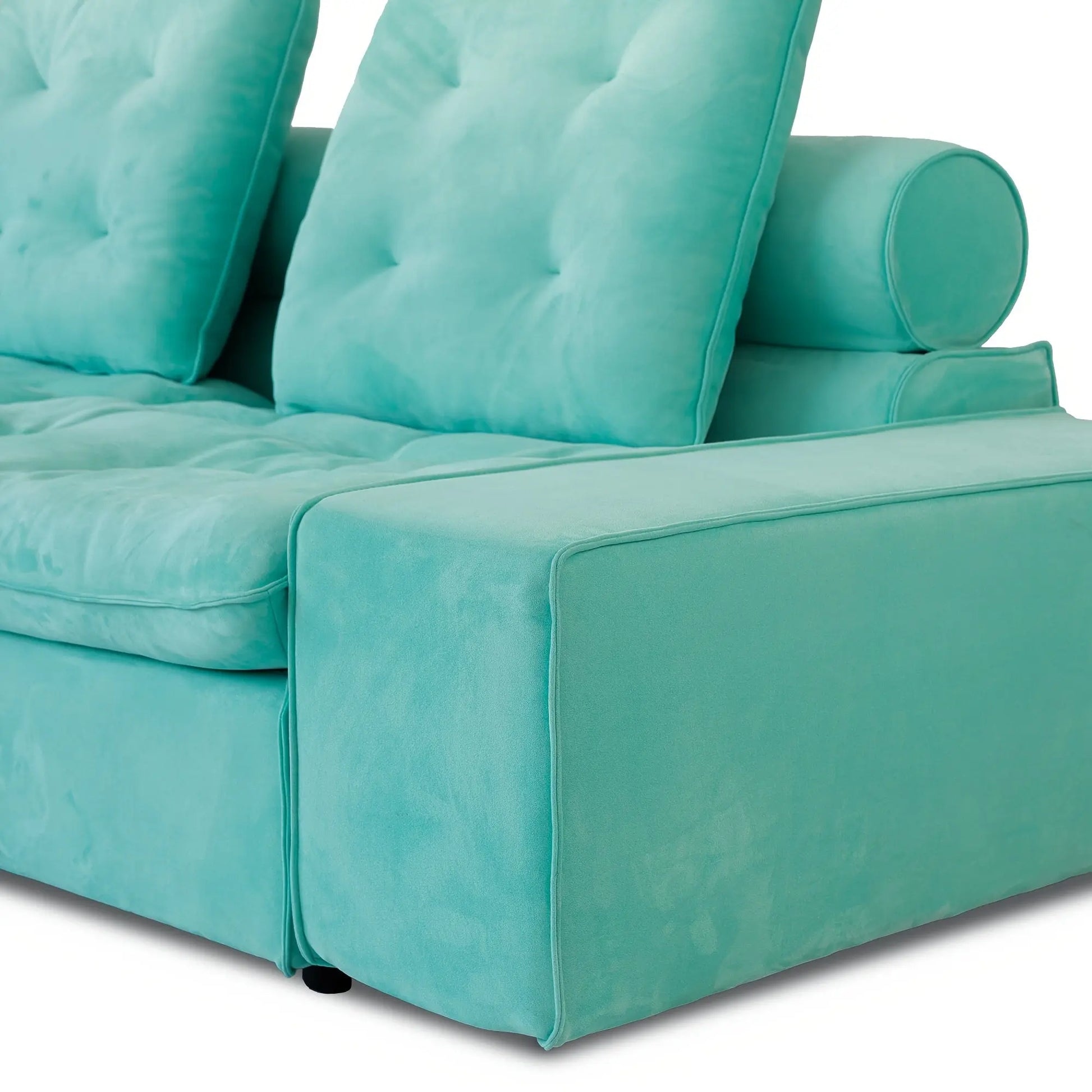 Turquoise sofa with tufted backrest on a white background