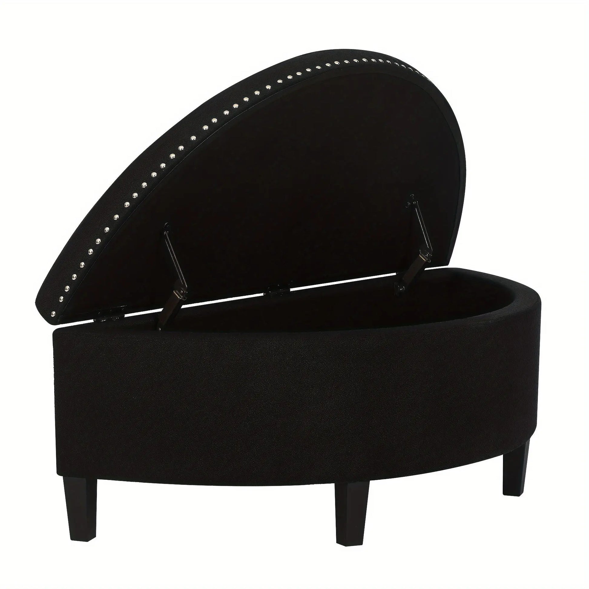 The Rhythm Storage Ottoman by Fantascticz in a timeless black fabric, shown with its lid propped open by a safety hinge to reveal the generous, lined storage space inside. The elegant silver nailhead trim provides a striking contrast.