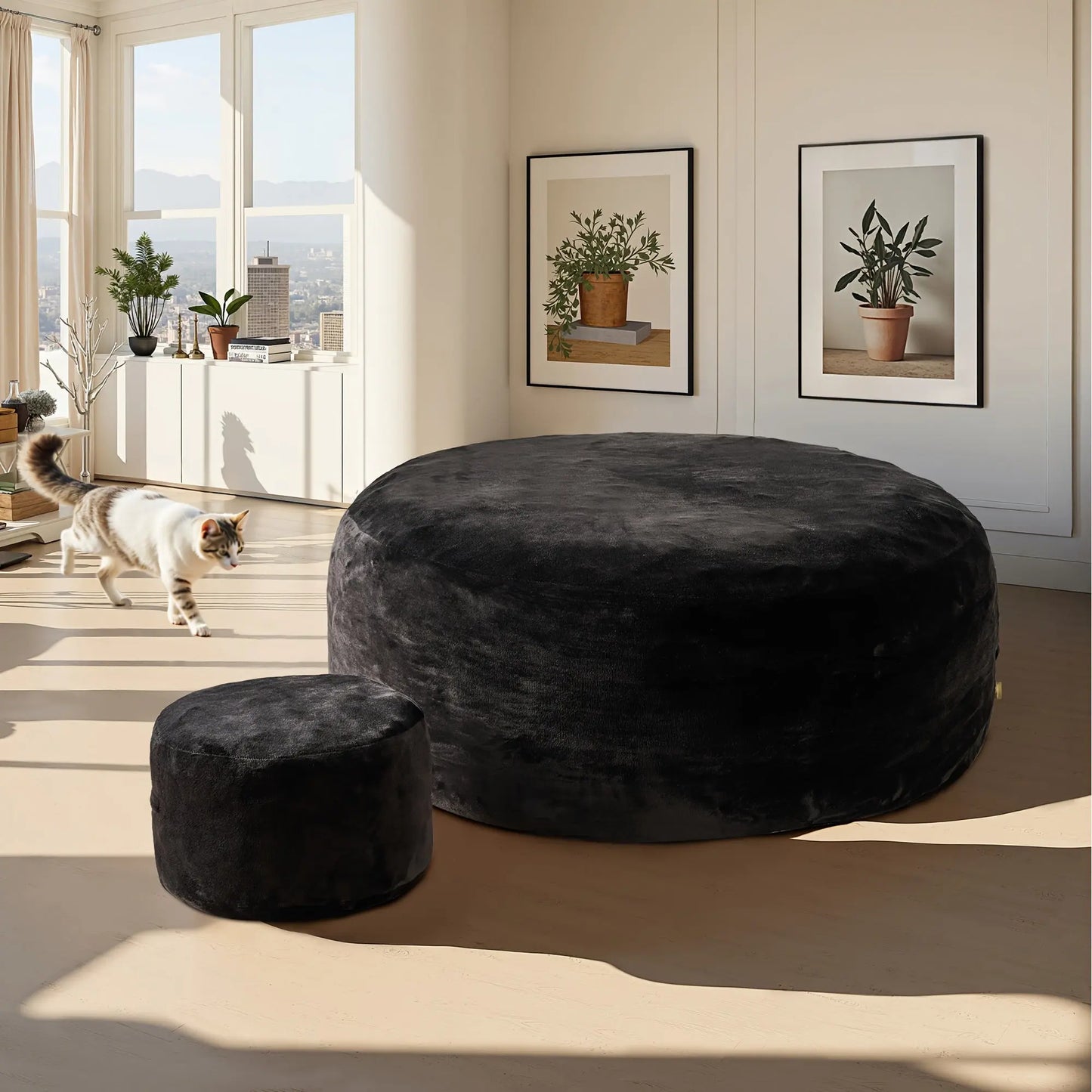 A lifestyle image of The Sanctuary Lounger and ottoman by Fantascticz, featured in a deep, velvety black fabric. The set makes a bold, sophisticated statement, anchoring the bright, modern living space with timeless style and luxurious comfort.