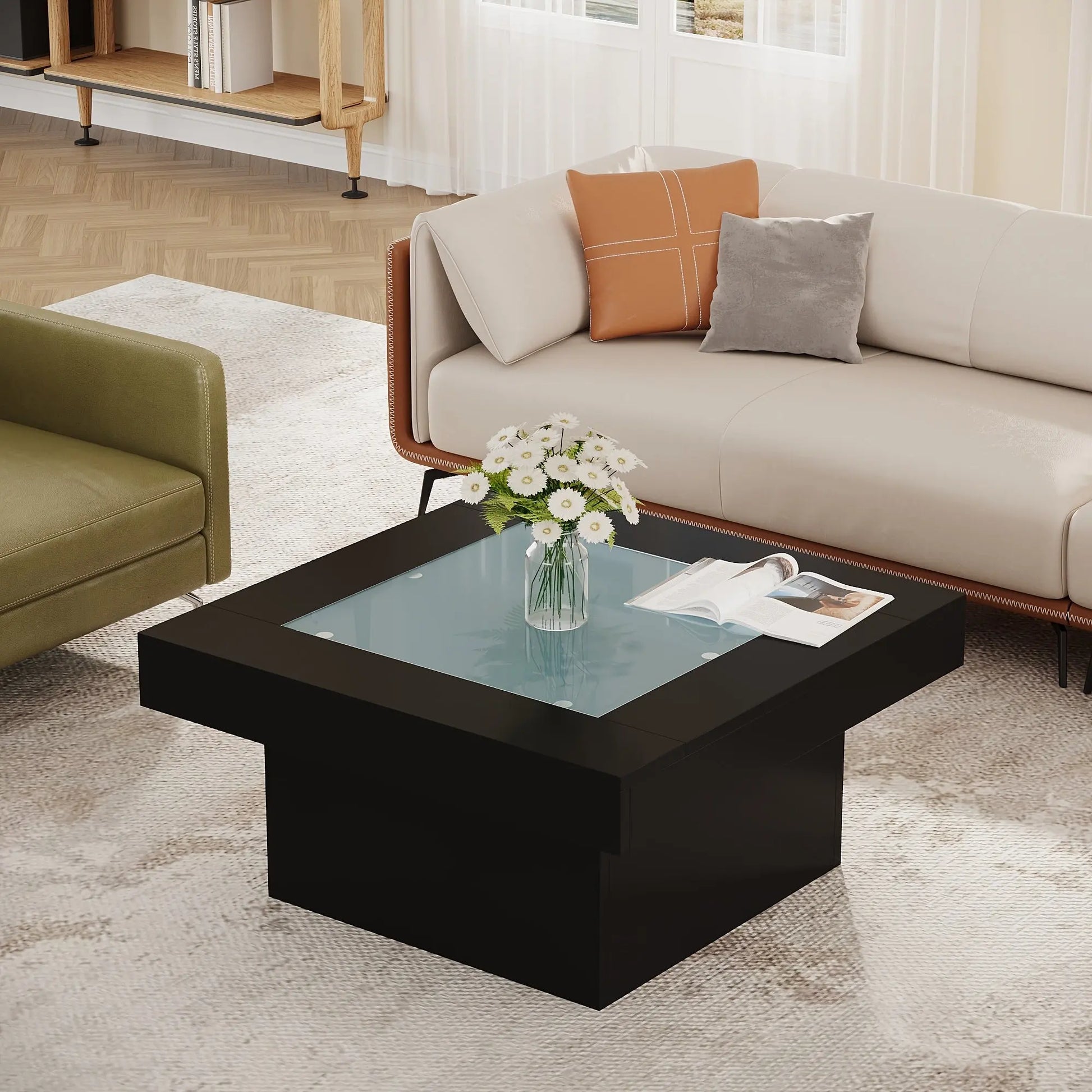 Modern living room with a black coffee table, sofa, and decorative items.