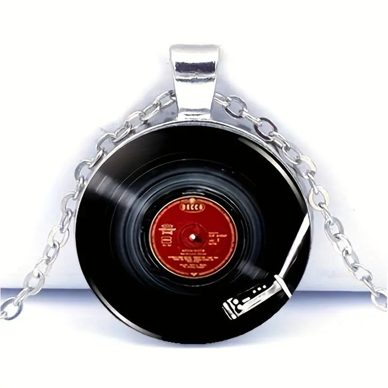Record necklace with silver chain on a white background