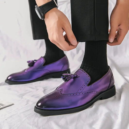 Model wearing The Strummer men's brogue loafers in high-gloss purple leather, styled with black trousers.
